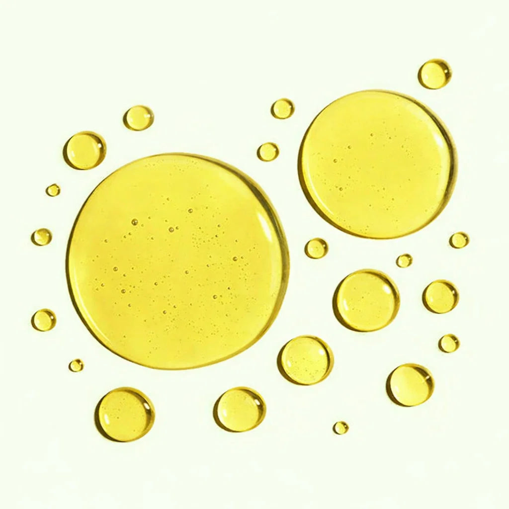 Yellow oil droplets on a white background