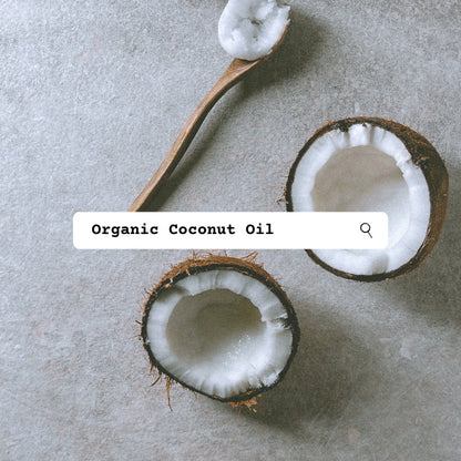 Coconut halves and a spoonful of coconut oil on a gray surface with 'Organic Coconut Oil' text overlay.