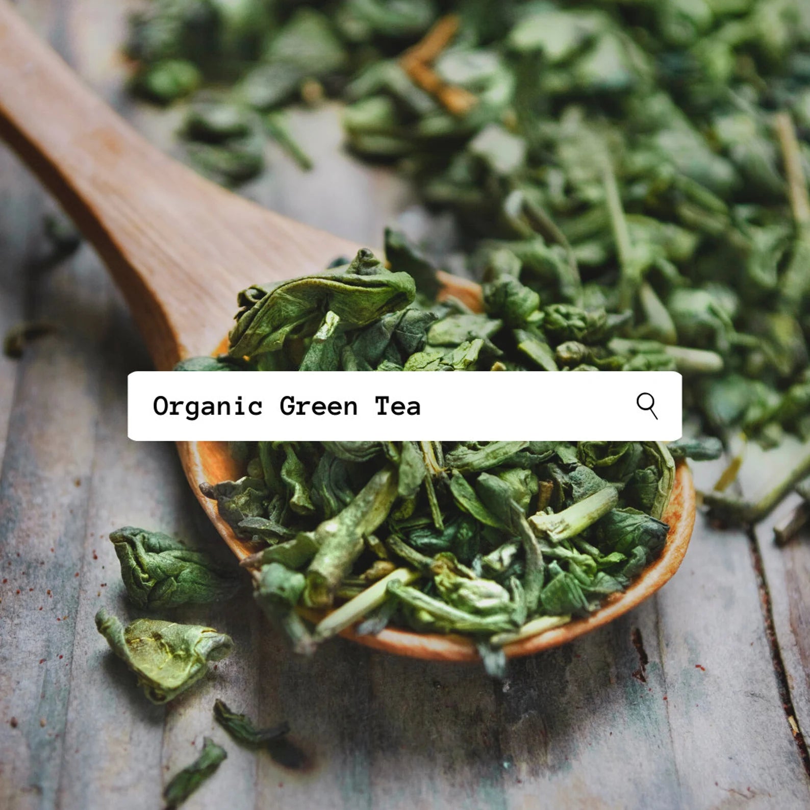Dried green tea leaves in a wooden spoon on a rustic surface with 'Organic Green Tea' text overlay.