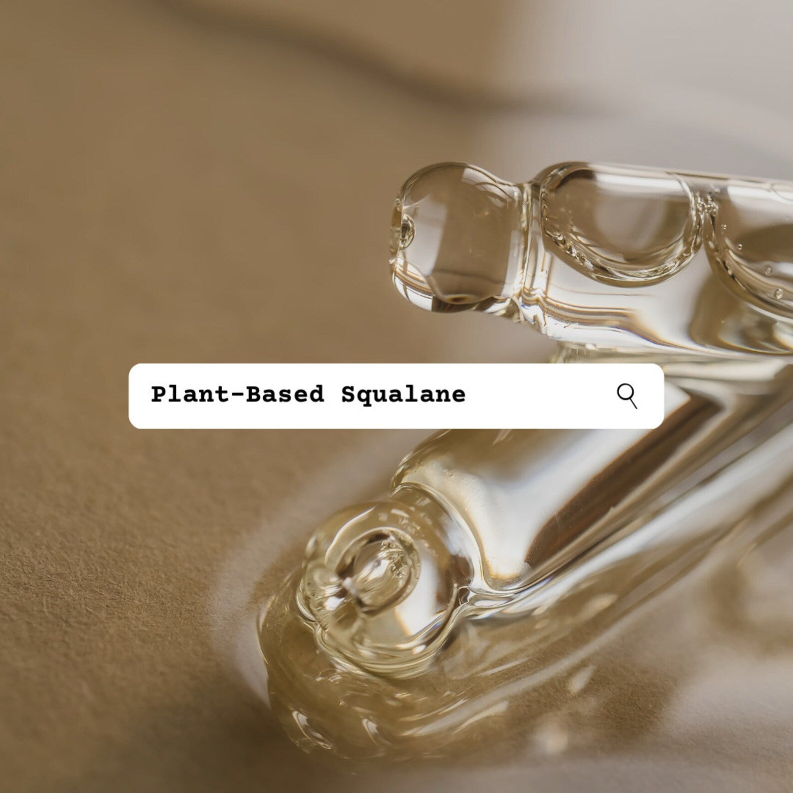 Close-up of plant-based squalane droplets with a textured background